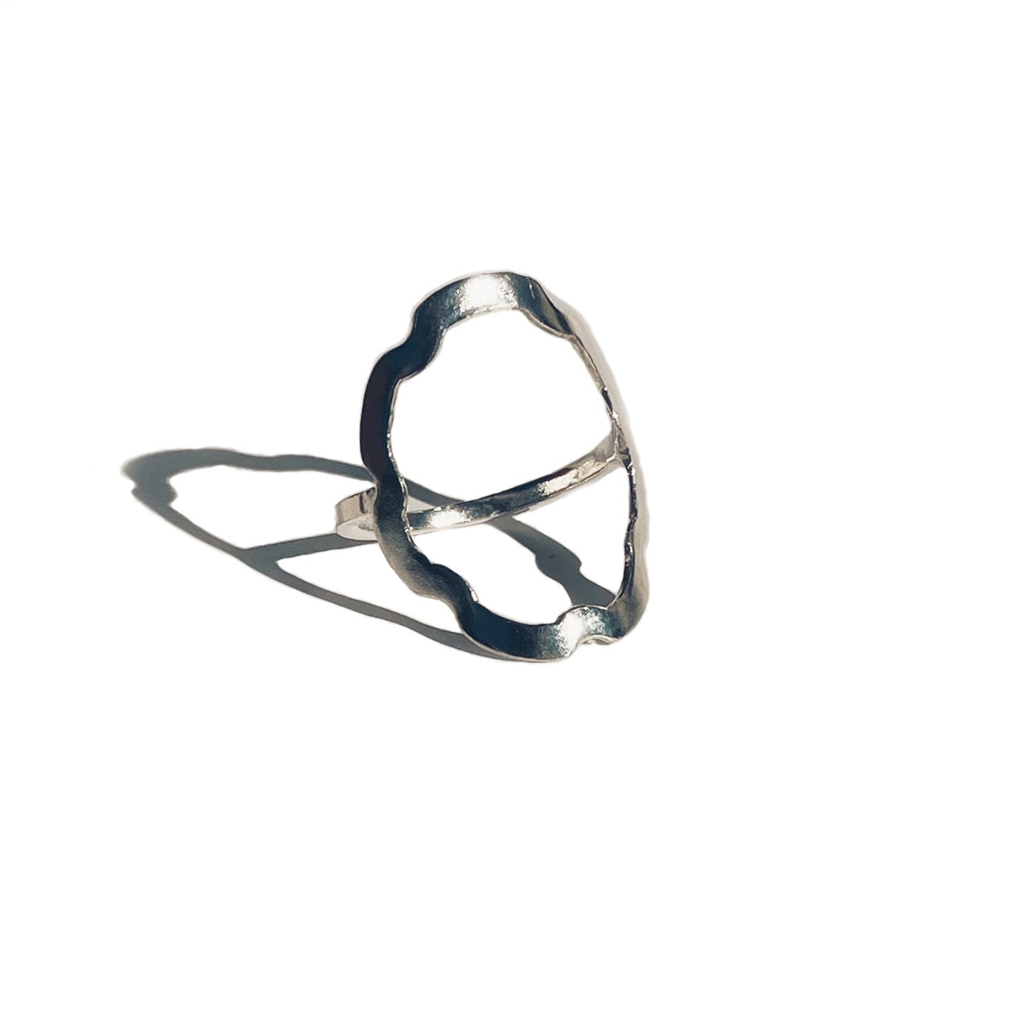 Inspired by the seven broad indentations of a euro coin and the Spanish flower, this sterling silver ring is both delicate and alluring with its fluted edges. It is tumbled for a lightly polished look and fits comfortably on the finger.