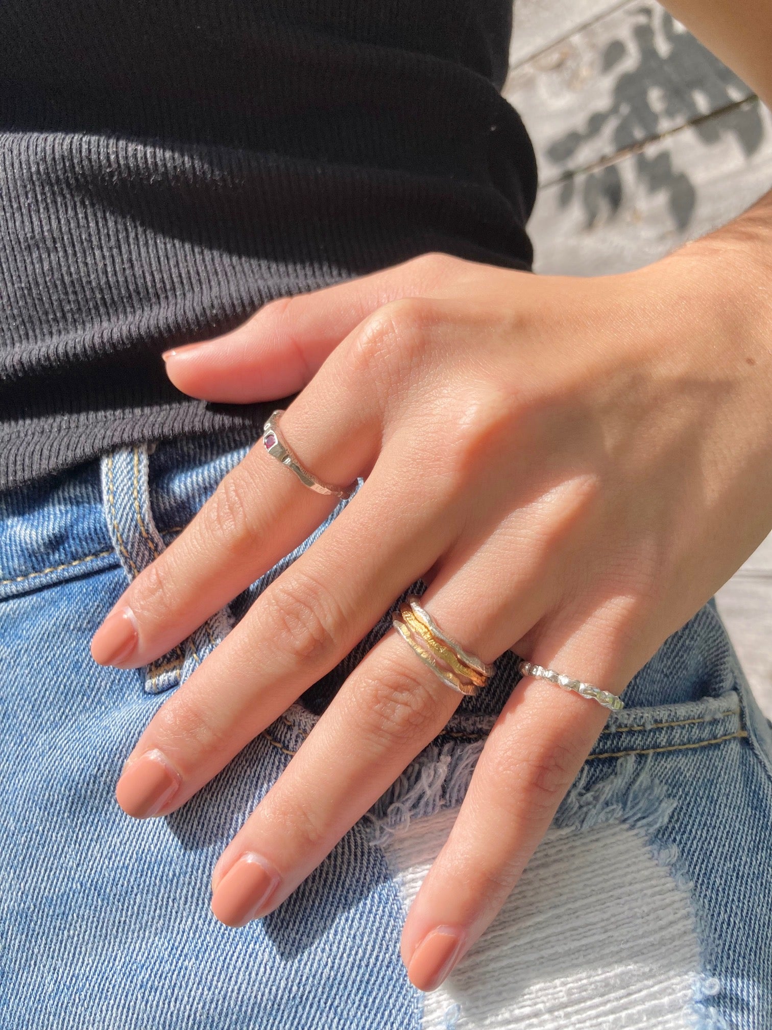 This handcarved solid sterling silver design is tumbled for a lightly polished finish.