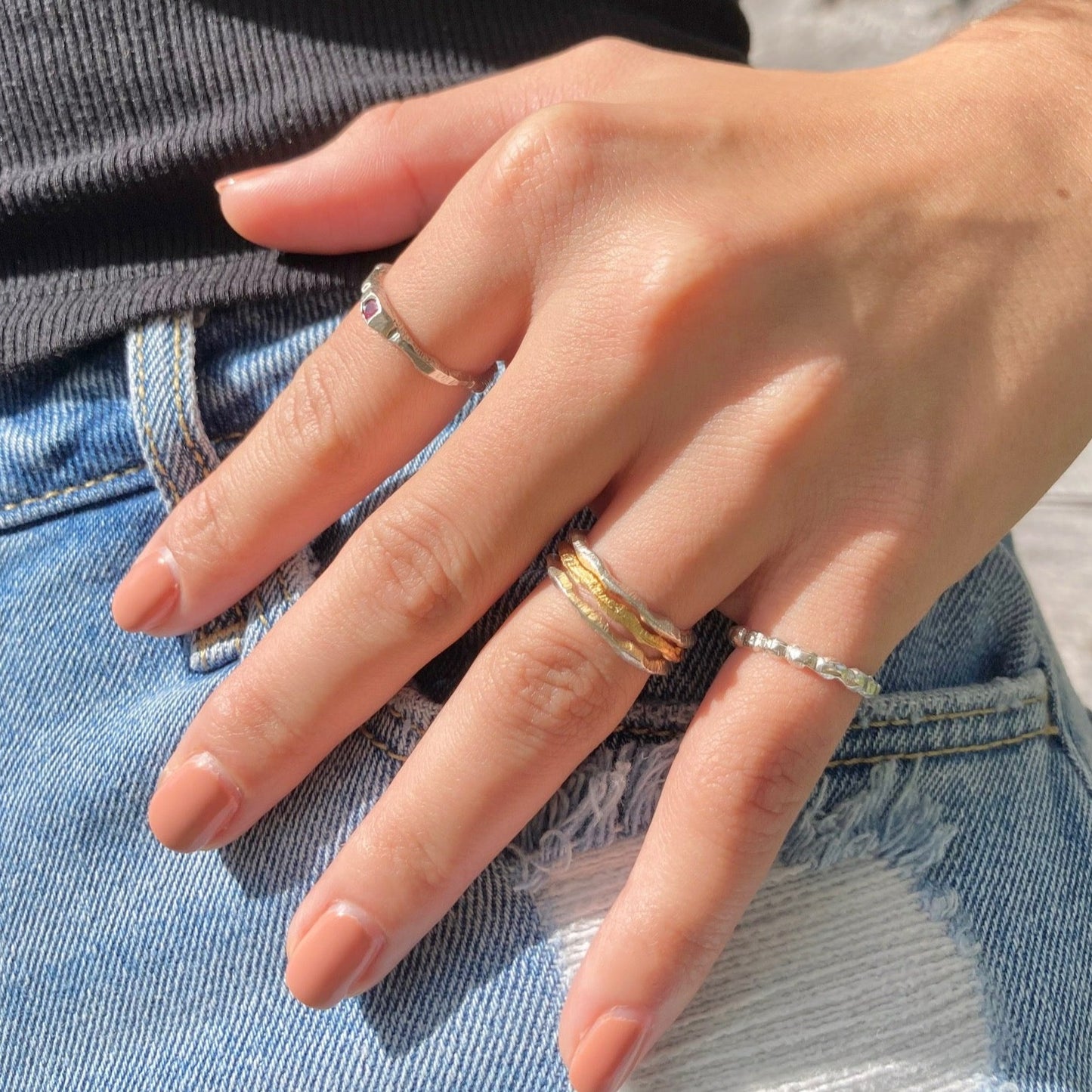 The petra ring incorporates a single bright pink sapphire using the cast in place approach, a beautifully imperfect way to include stones.  Sapphire is 3mm.