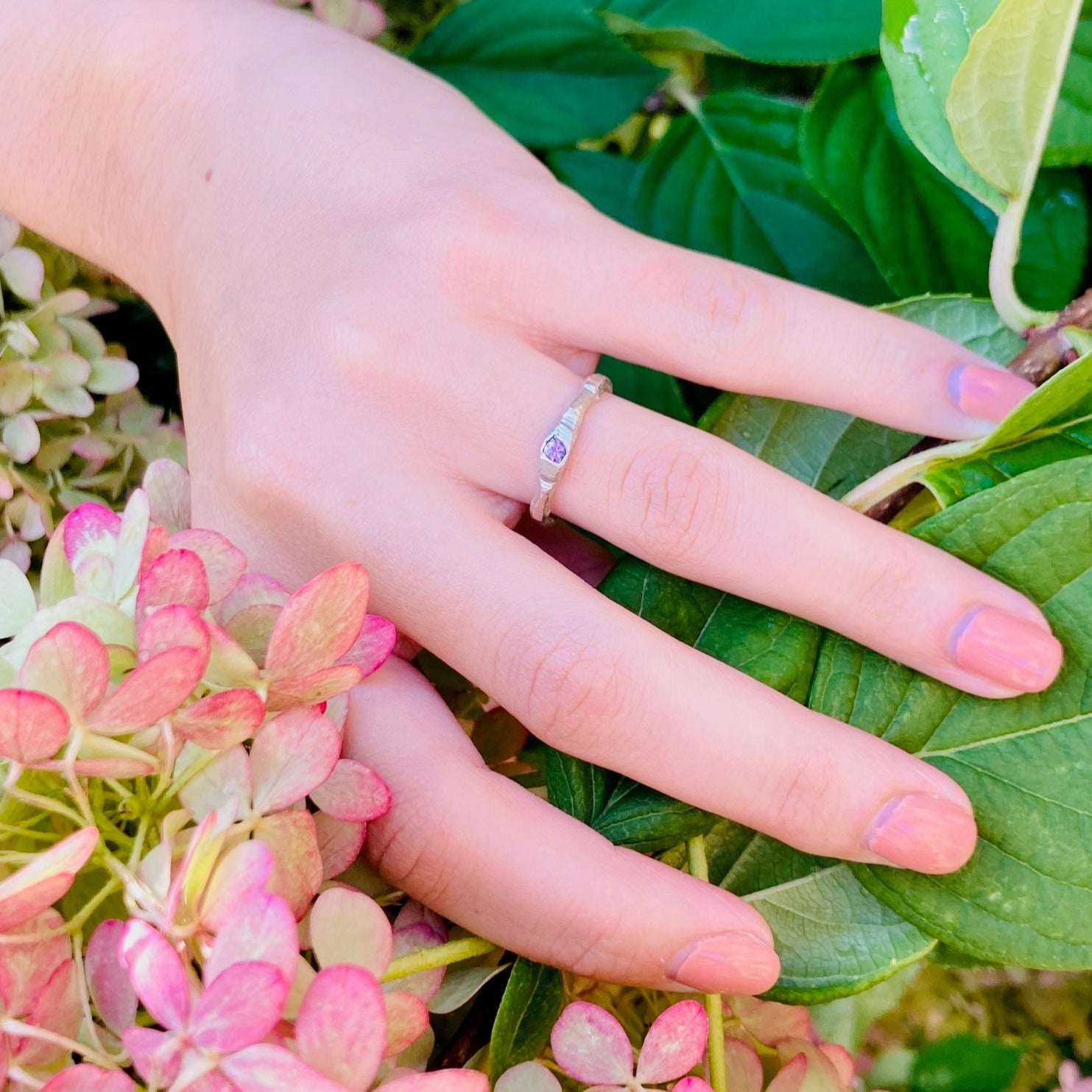 The petra ring incorporates a single bright pink sapphire using the cast in place approach, a beautifully imperfect way to include stones.  Sapphire is 3mm.