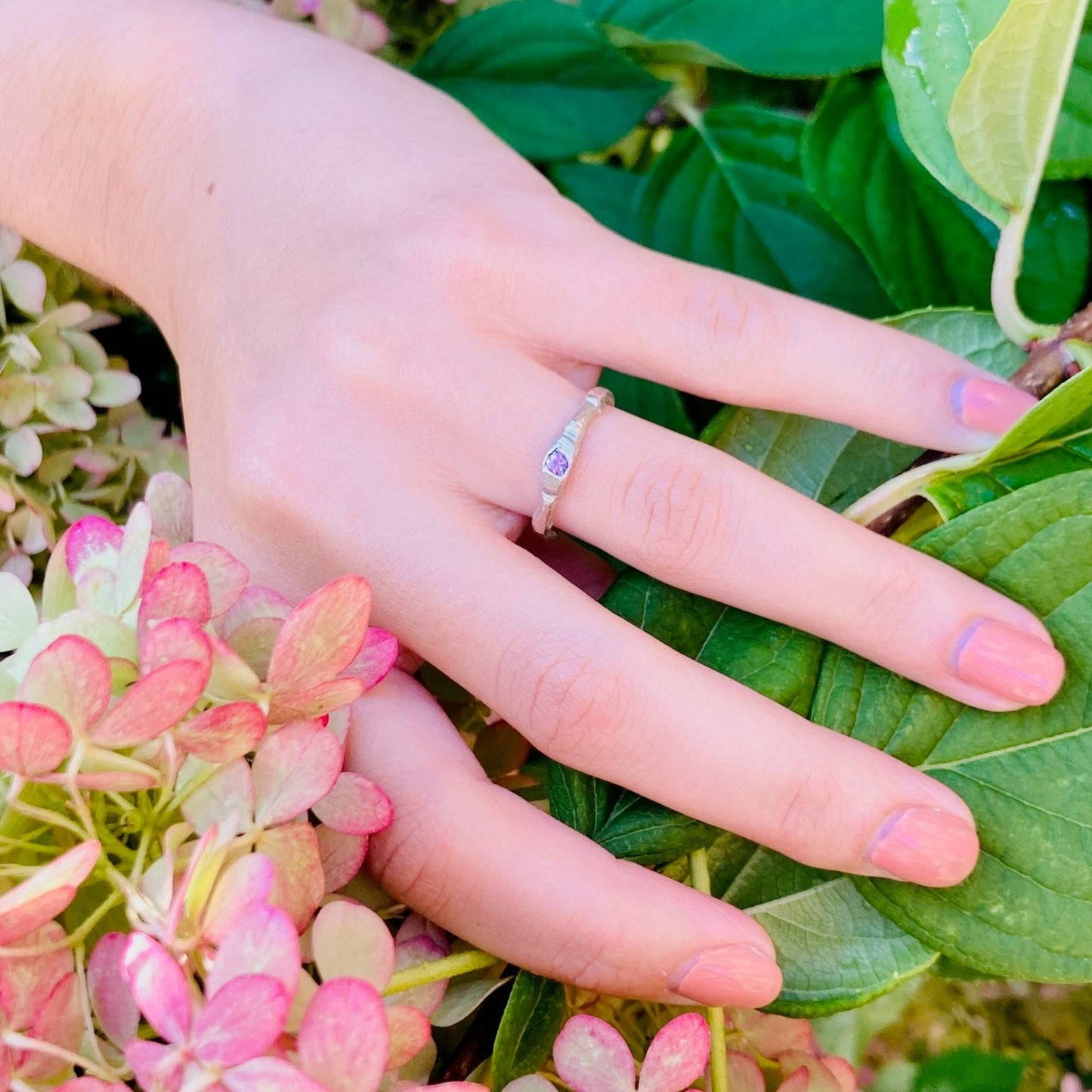 The petra ring incorporates a single bright pink sapphire using the cast in place approach, a beautifully imperfect way to include stones.  Sapphire is 3mm.