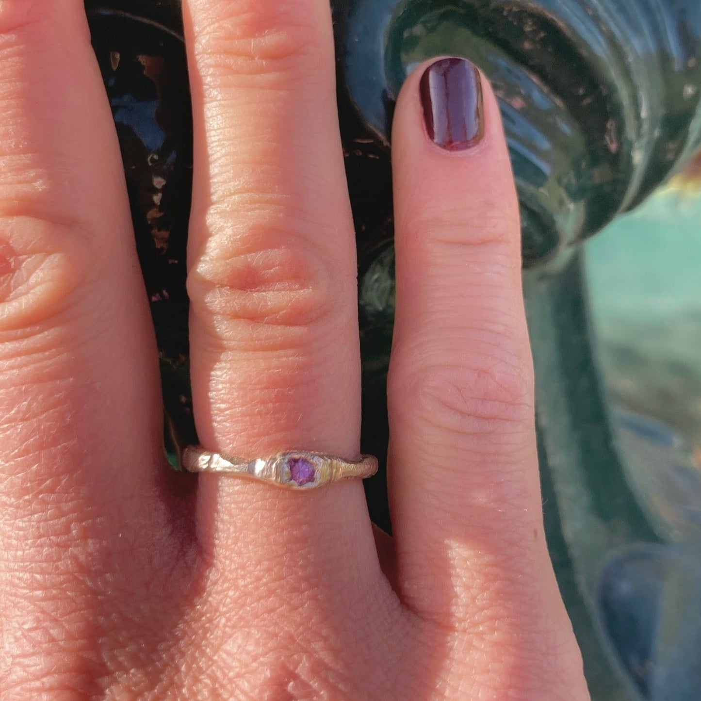 The petra ring incorporates a single bright pink sapphire using the cast in place approach, a beautifully imperfect way to include stones.  Sapphire is 3mm.